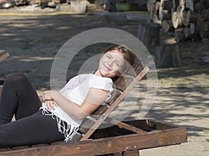 Young girl on a folding chair