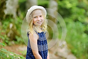 Young girl following a footpath around La Verna Sanctuary, Chiusi della Verna, in Casentino secular forest, one of the largest photo