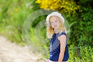 Young girl following a footpath around La Verna Sanctuary, Chiusi della Verna, in Casentino secular forest, one of the largest