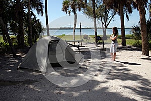 Young girl at Fort De Soto Park campsite in Pinellas County, Florida.