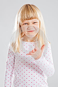 Young girl with funny grin photo