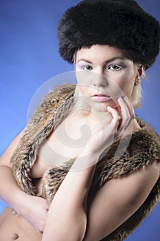 Young girl in fur vest