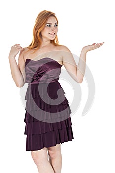 Young girl gesturing with hands for presentation. Redheaded girl