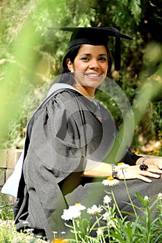 Young girl girl in a graduation gown.