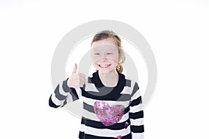 Young girl giving a thumbs up sign