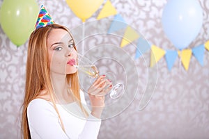 Young girl with glass of champagne