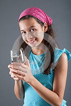 Young girl with a glass of water