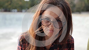 A young girl in glasses tries a sandwich, a sandwich is not tasty, disappointing, frustrating