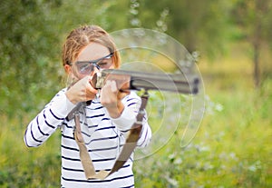A young girl with a gun for trap shooting