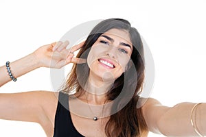 Young girl happy beautiful smiling woman taking a selfie with phone cell