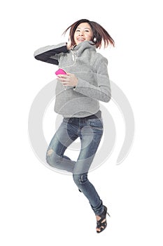 Young Girl happy jump and listen music