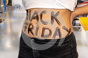 Young girl has written Black Friday on her stomach