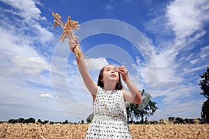 Young girl have fun in wheat field