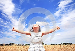 Young girl have fun in wheat field