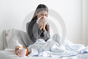 Young girl have running nose and sick in the bedroom