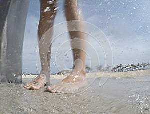 Young girl having a beach shower