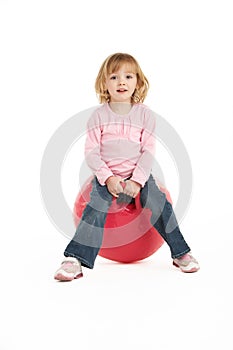 Young Girl Having Fun On Inflatable Hopper