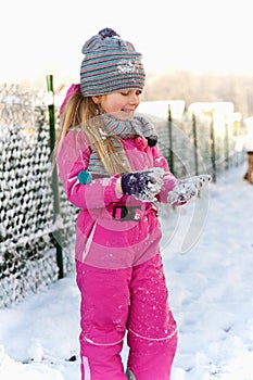 Young girl having fun in winter