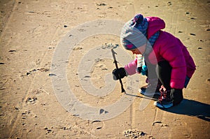 Young girl having fun on winter Baltic beach