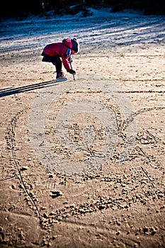 Young girl having fun on winter Baltic beach