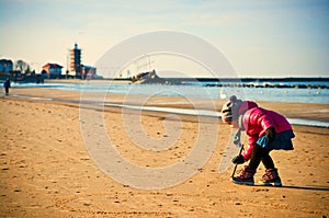 Young girl having fun on winter Baltic beach