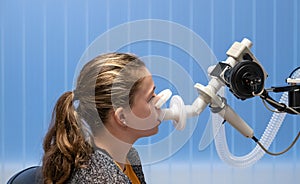 A young girl having a lung function test