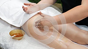 Young girl having massage of body in the spa salon. Beauty treatment concept