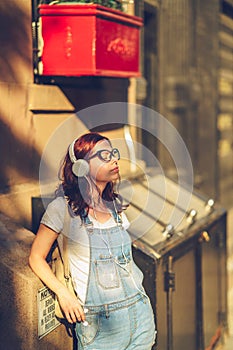 Young girl in headphones in New York City