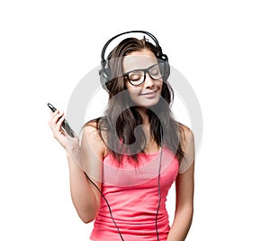 Young girl with headphones on white background