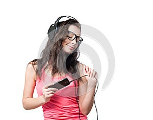 Young girl with headphones on white background