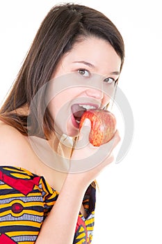 Young girl healthy eating on white background red apple