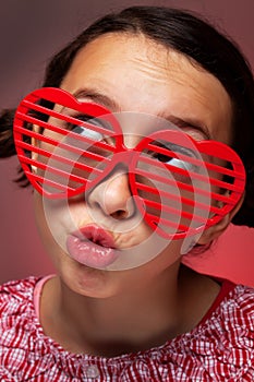 Young girl with heart shaped shutter shades