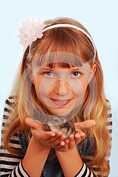 Young girl with her hamster