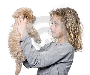 Young girl with her toy Poodle puppy (9 weeks old)