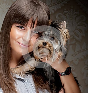 Young girl with her Yorkie puppy