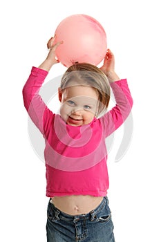 Young girl holding ball showing navel