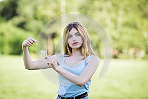 Young girl holding cardboard bin icon