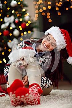 Young girl holding a Christmas present puppy dog