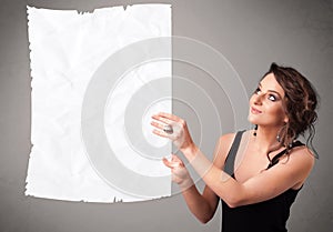 Young girl holding crumpled white paper copy space