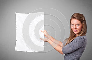 Young girl holding crumpled white paper copy space