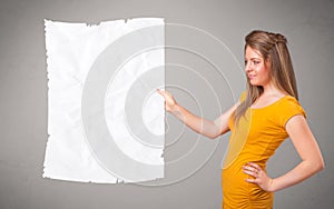 Young girl holding crumpled white paper copy space