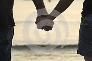 Young girl holding hands