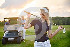 Young girl holding her golf club