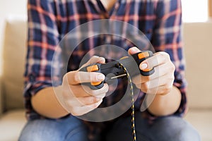 Young girl holding joystick while playing video games