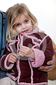 Young girl holding a lolly