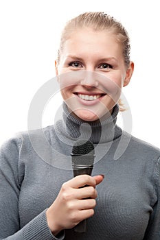 Young girl holding microphone