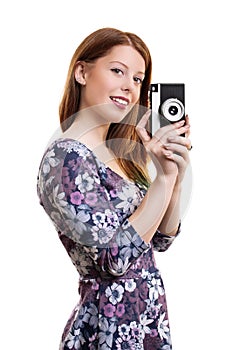 Young girl holding old film camera