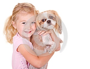 Young girl holding pet dog