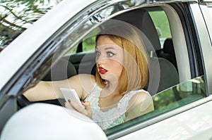 Young girl, holding phone in hand looked directly