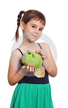 Young girl holding piggybank